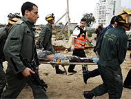 Civilians injured by Grad missile attack in Ashkelon evacuated by Search and Rescue Unit