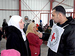 West Bank, Qalandya checkpoint. ICRC programme enabling families of Palestinian detainees held in Israel to visit them. (photo: ICRC)
