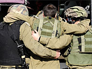 IDF soldiers supporting a wounded comrade