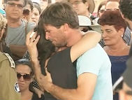 Gila & Doron Tragerman mourning at the funeral of their son, Daniel, who was killed in August