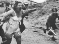 Woman chased by men and youth armed with clubs, Medova Street in Lviv, Ukraine, July 1941.
