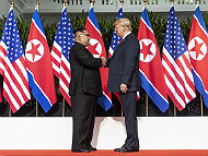 Kim and Trump shaking hands at the red carpet during the DPRK–USA Singapore Summit (Photo by: Dan Scavino Jr., Public Domain)