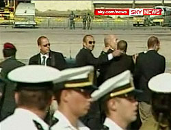 Ehud Olmert escorted to the armoured car
