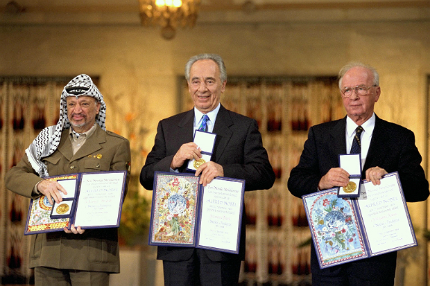 Yitzhak Rabin, Shimon Peres and Yasser Arafat receiving the Nobel Peace Prize following the Oslo Accords
