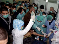 photo released by the Syrian official news agency SANA, Syrian victim who suffered an alleged chemical attack at Khan al-Assal village according to SANA, receives treatment by doctors at a hospital in Aleppo, Syria. (AP Photo/SANA, File)