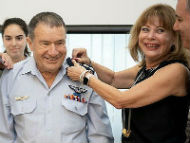 Brigadier Gen. Giora Epstein receiving his award by his wife (Photo courtest of GPO)