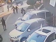 Attacker running after people who had escaped the bus in Tel Aviv (photo credit: Channel 2 News)