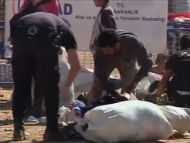 As the violence spills over into Turkey: Turkish border police checking the belongings of Syrian refugees seeking shelter