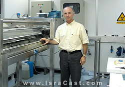 David Waxman, Atlantium CEO, next to UV water purification system